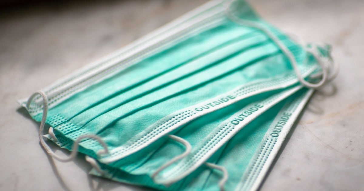 Care worker wearing PPE and following infection prevention protocols in a domiciliary care setting