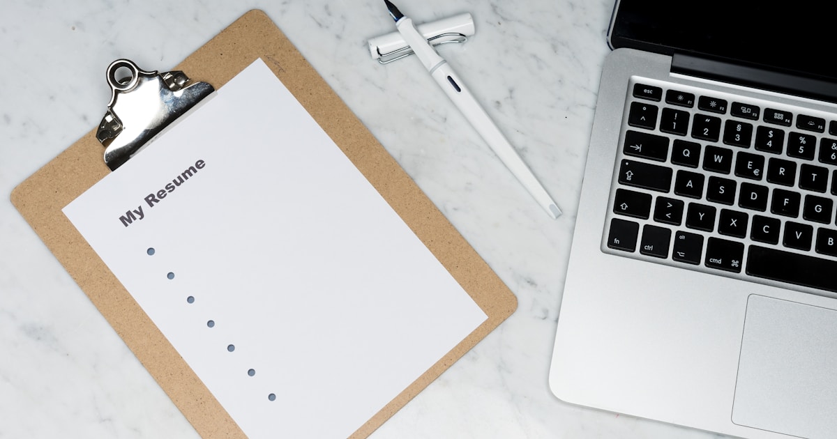 Professional document on a desk representing a CQC Statement of Purpose for a domiciliary care agency