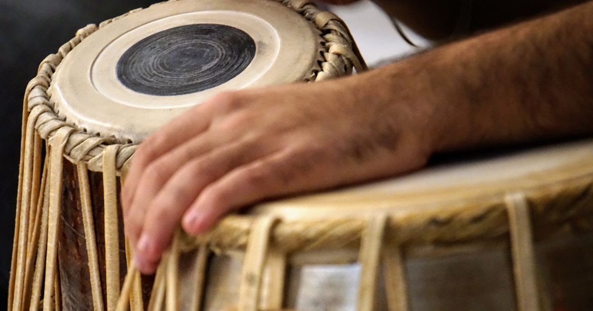 Complete document pack for CQC registration of a domiciliary care agency laid out on a professional desk